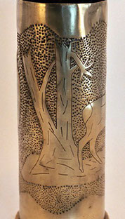 Shell with two deer emerging in open field&nbsp; from a devastated forest