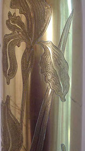 Pair of shells with blooming irises engraved in zig-zag technique.