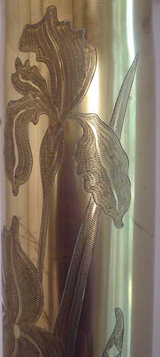 Pair of shells with blooming irises engraved in zig-zag technique.