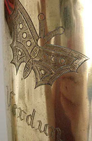 Pair of shells with irises, butterflies and VERDUN engraved in Gothic script.