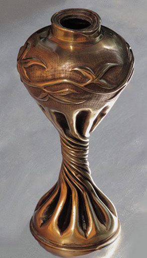 Shell bulbous with a garland decoration, on a lower body very fluted and twisted 