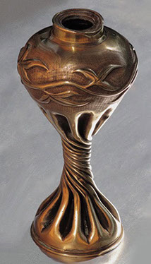 Shell bulbous with a garland decoration, on a lower body very fluted and twisted 