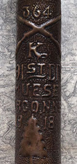 91st Division shell embossed 364, crossed rifles [company] K, MUESE (sic) ARGONNE 1918, and pine tree insignia.