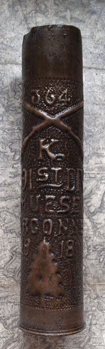 91st Division shell embossed 364, crossed rifles [company] K, MUESE (sic) ARGONNE 1918, and pine tree insignia.