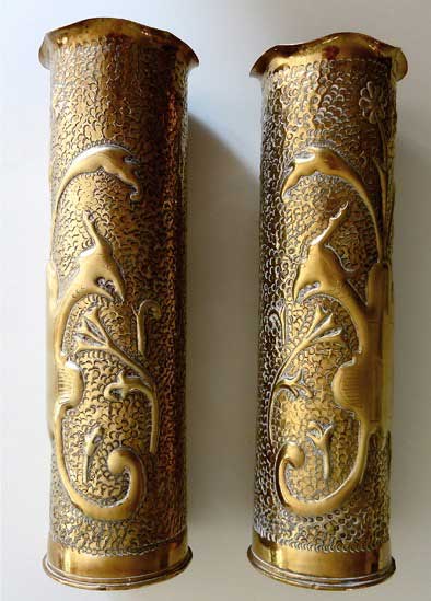 Pair of shells with mythical birds with foliage on an embossed background