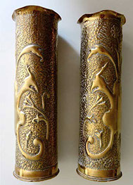 Pair of shells with mythical birds with foliage on an embossed background