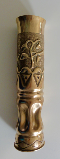 Shell with Masonic symbols and flower on the upper part, row of triangles and dots, lower body slightly fluted.