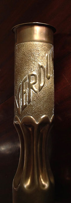 At the back VERDUN on an embossed background, and a fluted body