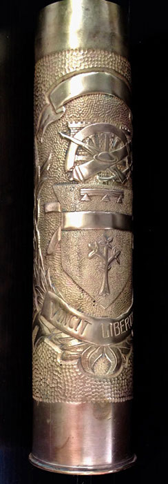 Upper band, below:&nbsp; a group of Engineers castle, half-finished spoked wheel, cannon, cavalry saber, rifle, doughboy helmet,&nbsp; then an escutcheon.