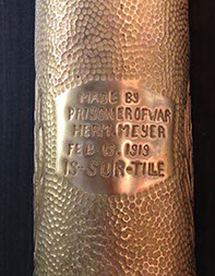 At the back medallion engraved MADE BY PRISONER OF WAR HERM. MEYER&nbsp; FEB.13.1919&nbsp;&nbsp; IS-SUR-TILLE
