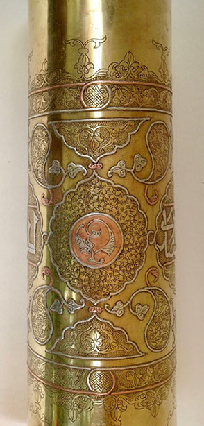 Shell highly decorated in Damascene work of inlaid copper and silver.