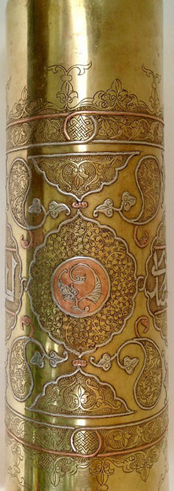 Shell highly decorated in Damascene work of inlaid copper and silver.