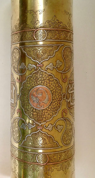 Shell highly decorated in Damascene work of inlaid copper and silver.