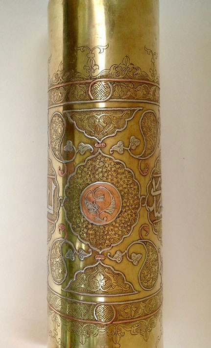 Shell highly decorated in Damascene work of inlaid copper and silver.