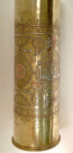 Shell decorated in DAMASCENE&nbsp; work of inlaid copper and silver and Arabian calligraphy in medallion.
