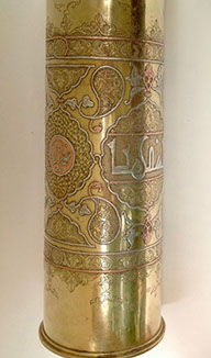 Shell decorated in DAMASCENE&nbsp; work of inlaid copper and silver and Arabian calligraphy in medallion.