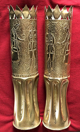 Pair of shells depicting a French officer looking at a woman in uniform smoking and harboring a bob haircut. Initials G. for him, A. for her.