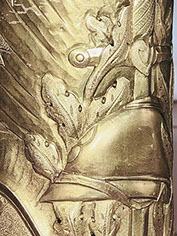 Shell with symbols as oak, olive, sunburst. Adrian helmet resting on sword is also found on WWI monuments and medals.