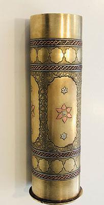 Shell decorated with copper band, embossed floral designs. Ten Commandments tablets in six-pointed star. Marked Bezalel in Hebreu.