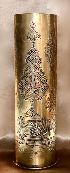 Shell with inlaid copper and silver. Traditional arabesques and Arabic script.
