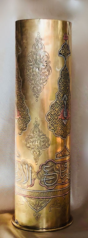 Shell with inlaid copper and silver. Traditional arabesques and Arabic script.