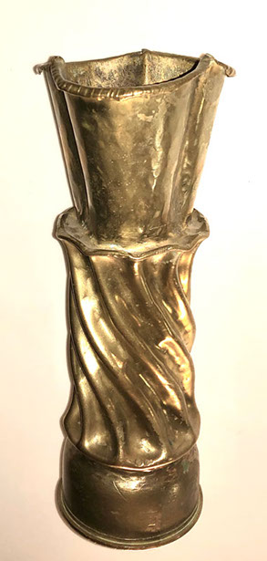 Shell with a fluted and twisted body on a trilobed flared top. H 10"