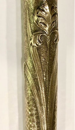 On a dappled and speckled background, with a pie crust top. Heavily varnished. H 14". Franch shell dated 1889-like the Eiffel tower.