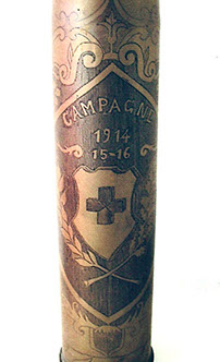 Shell engraved Campagne 1914-15-16. Central medallion with a cross, flanked by two palms. Leafy garland around.