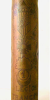 Shell engraved with Croix de guerre with three palms, ARTOIS, CHAMPAGNE, SOMME, flaming bomb with #1 and LEGION ETRANGERE