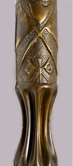 Shell with a burning torch flanked by two square signal flags crossed.