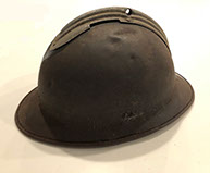 Adrian helmet with a bullet hole.