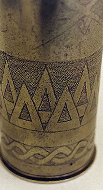 shell decorated by Emile Delsol with rows of triangles&nbsp; around the body and intertwined ribbons in lower band.