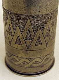 shell decorated by Emile Delsol with rows of triangles&nbsp; around the body and intertwined ribbons in lower band.