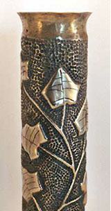 IVY crawling up in a blackened background. Top flared.