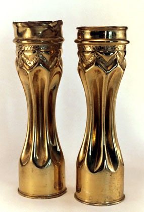 Shells fluted and varnished with a zig zag band decorated.