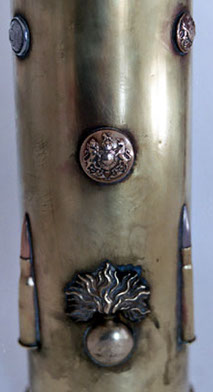 Details of cartridges&nbsp; (8mm Lebel) and buttons (flaming bombs)