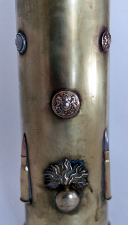 Details of cartridges&nbsp; (8mm Lebel) and buttons (flaming bombs)