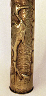 Shell with a heron in a marshland near a rippled lake.