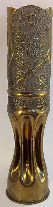 Letter C (for troop C). Crossed sabers (cavalry insignia)