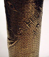 Shell embossed town of Tahure from the stems of letters from Champagne. Background of squares with central dots.