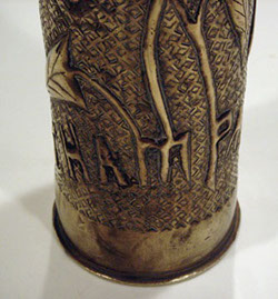 Shell Tahure Champagne, letters M and P extended as stems for flowers. 1918.